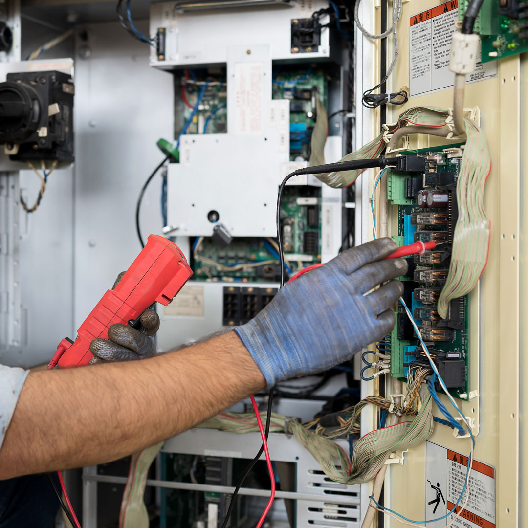Commercial Electrical Service, Electrician Working on Business Electrical System